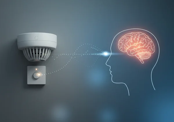 Abstract image of a smoke detector next to a human brain.